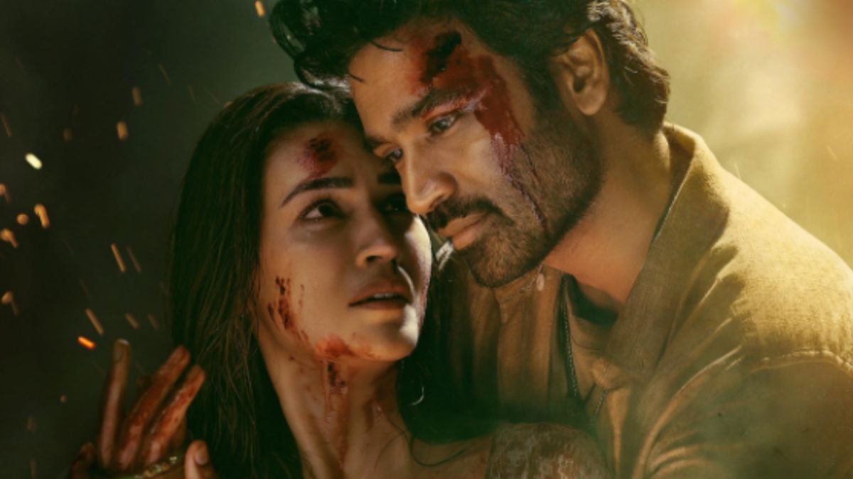 Tere Ishk Mein poster featuring Dhanush and Kriti Sanon in romantic scene